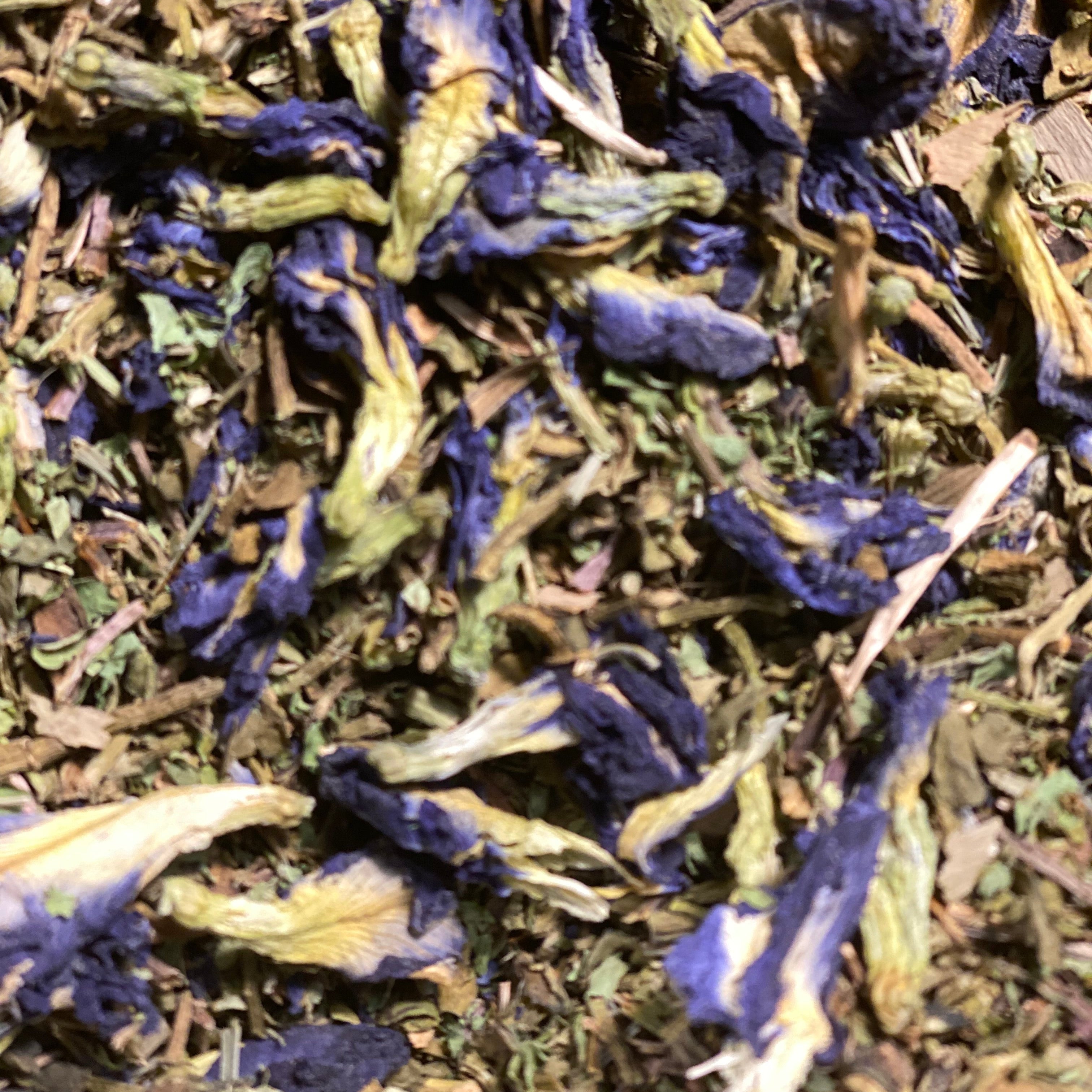 Close-up of dried butterfly pea flowers and green leaves Bacopa Monnieri for brain health by Ayoni Wellness